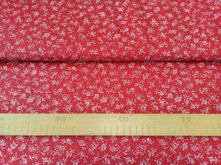 Bílé drobné růžičky na červené