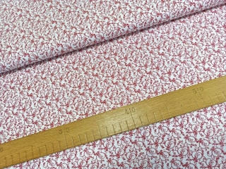 Tmavě červený filigránový vzoreček na bílé